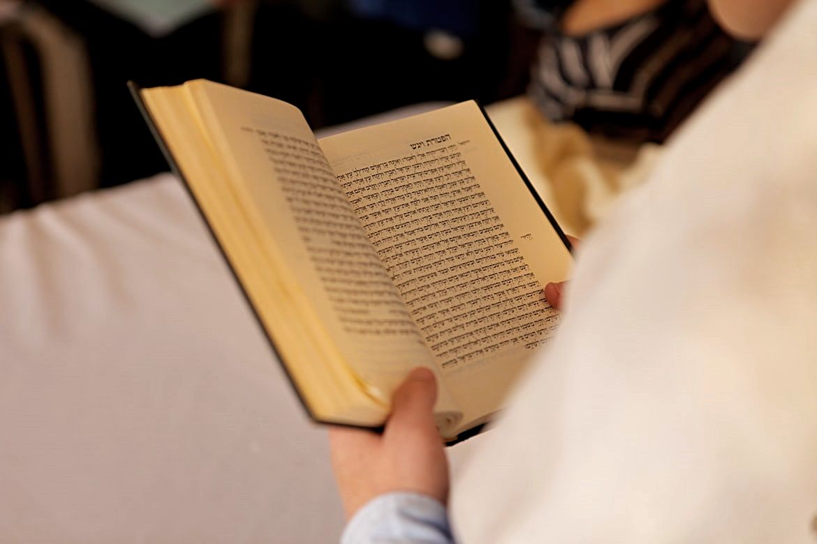 A  person reading the Book of Ezekiel in the Hebrew Bible