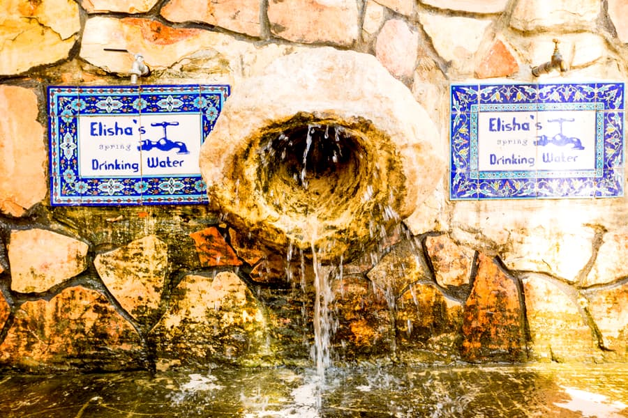 Elisha spring fountain at the entrance of Tell es-Sultan the oldest city in the world Jericho. Elisha's spring drinking water.